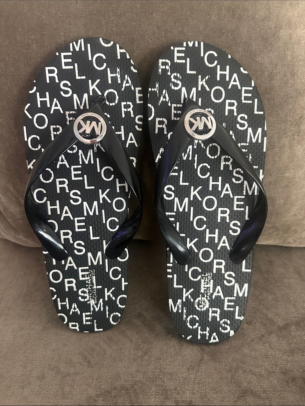 Michael Kors flip flops.  New W/O tags. Size 9